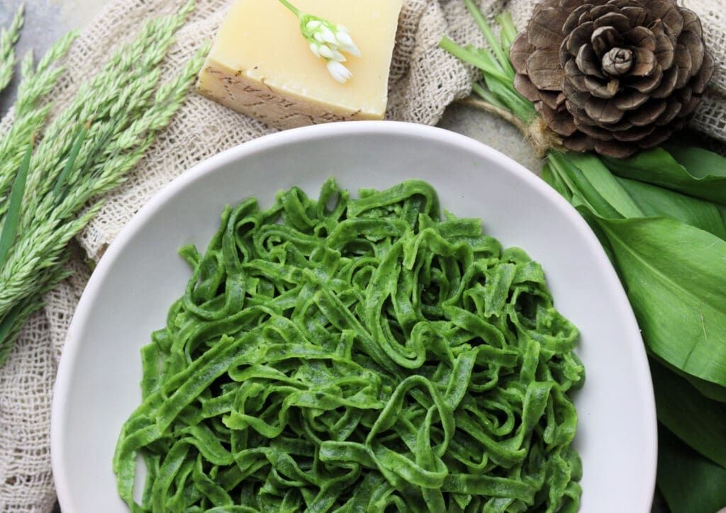 beautiful serving of homemade fresh green wild garlic pasta